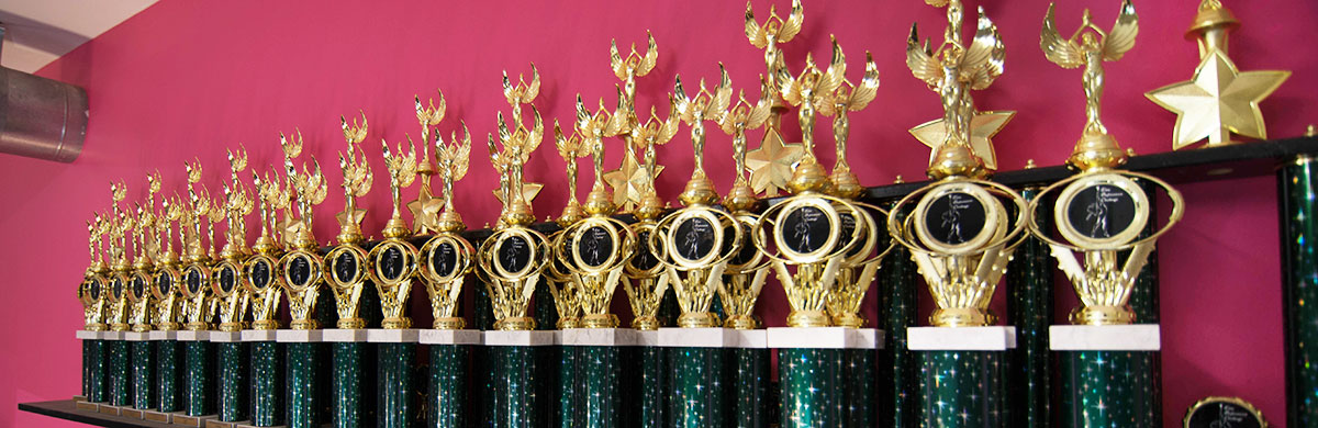 line of trophies won by FSA competetive students